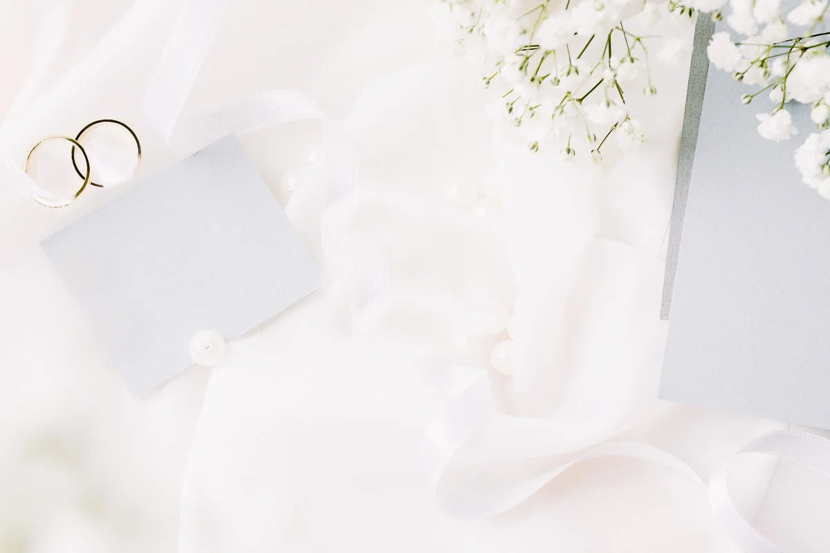 Soft wedding detail with ribbon and flowers